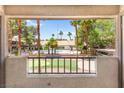 Scenic view of the community pool surrounded by lush palm trees at 2606 S Durango Dr # 245, Las Vegas, NV 89117