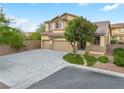 Lovely two-story home featuring a spacious driveway, mature trees, and a charming facade at 3273 Alcudia Bay Ave, Las Vegas, NV 89141