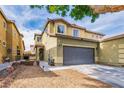 Two-story home showcasing a two-car garage and neutral color scheme with well-kept landscaping at 3728 Juanita May Ave, North Las Vegas, NV 89032