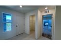 Bright entryway featuring tile flooring, coat closet, and views to the outdoor patio at 4705 Parkarbor Ave, Las Vegas, NV 89141