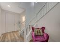 Bright entryway with a staircase featuring white railings, leading to the upper levels of the home at 5244 Fiery Sky Ridge St, Las Vegas, NV 89148