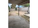 View of backyard with a concrete patio area and a block wall at 5389 Spencer St, Las Vegas, NV 89119