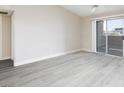 Bright, airy living room showcasing sleek floors and sliding glass doors to balcony at 555 E Silverado Ranch Blvd # 2164, Las Vegas, NV 89183