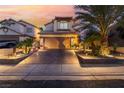 Charming two-story home features a well-manicured yard and spacious driveway at 5779 Baffy Cir, Las Vegas, NV 89142