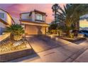 Charming two-story home features a well-manicured yard and spacious driveway at 5779 Baffy Cir, Las Vegas, NV 89142