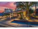 Charming two-story home features a well-manicured yard and spacious driveway at 5779 Baffy Cir, Las Vegas, NV 89142