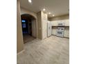 Bright kitchen features white appliances, ample cabinets, and marble-like flooring at 5861 Varese Dr, Las Vegas, NV 89141