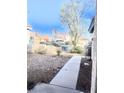 View of the backyard featuring desert landscaping and a view of neighboring houses at 6374 Horizon Ridge Ct, Las Vegas, NV 89156
