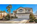 Lovely two-story house boasts a three-car garage and mature landscaping at 6971 Cedar Basin Ave, Las Vegas, NV 89142