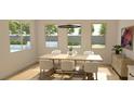 Bright dining room with a modern chandelier and views of the landscaped backyard at 6985 Unicorn Street, Las Vegas, NV 89131