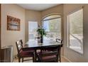 Cozy breakfast nook bathed in natural light from multiple windows at 805 Palmero Way, Boulder City, NV 89005