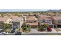 A beautiful home nestled in a well-maintained neighborhood with lush landscaping and a large driveway at 9039 Alex Creek Ave, Las Vegas, NV 89149