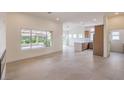 Spacious living room boasts lots of natural light and an open floor plan for entertaining at 10421 Linfield Pl, Las Vegas, NV 89134