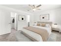 Serene primary bedroom retreat featuring neutral decor, plush carpeting, and ample natural light at 1103 Tektite Ave, Henderson, NV 89011