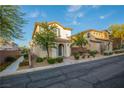 Beautiful home with desert landscaping and a charming arched entryway at 11044 Camden Bay St, Las Vegas, NV 89179