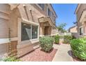 Charming front entrance with manicured bushes and walkway at 1554 Ward Frontier Ln, Henderson, NV 89002