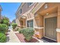 Townhome front entrance with landscaped yard at 1554 Ward Frontier Ln, Henderson, NV 89002