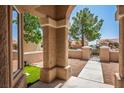 Inviting front entrance with stone pillars, a tiled porch, and a view of the landscaped yard at 2315 Sun Cliffs St, Las Vegas, NV 89134