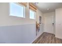 Inviting entryway with natural light, wood floors, and neutral wall paint with a modern aesthetic at 2642 Begonia Falls Ave # 40, North Las Vegas, NV 89081
