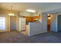 Comfortable living space featuring neutral carpet, with easy access to the kitchen and bathroom at 3400 Cabana Dr # 2010, Las Vegas, NV 89122