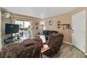 Inviting living room features cozy seating, neutral decor, and sliding glass doors to the patio at 3550 Bay Sands Dr # 1003, Laughlin, NV 89029