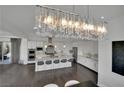 Gourmet kitchen featuring an oversized island, stainless steel appliances, and custom cabinetry at 362 Port Reggio St, Las Vegas, NV 89138
