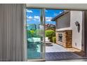 Inviting outdoor patio with comfortable seating and a stone fireplace perfect for relaxing at 362 Port Reggio St, Las Vegas, NV 89138