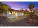 Backyard featuring a large patio, desert landscaping, and a view of the sky at 433 Old Palms Dr, Las Vegas, NV 89123