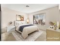 Staged bedroom with neutral decor and comfortable furniture at 433 Old Palms Dr, Las Vegas, NV 89123