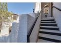 Staircase leading up to an elevated entry, offering architectural charm at 50 Aura De Blanco St # 18204, Henderson, NV 89074
