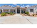 Inviting single-story home with well-maintained landscaping and a long driveway at 60 N Fogg St, Las Vegas, NV 89110