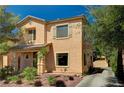 Attractive stucco home with desert landscaping and a convenient attached garage at 6437 Boatbill St, North Las Vegas, NV 89084
