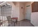 Cozy covered front porch with seating, creating a welcoming entrance to the home at 6624 Old Oxford Ave, Las Vegas, NV 89108