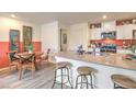 Beautiful open kitchen featuring a breakfast bar, stainless appliances, and a dining area at 6926 Wrightshire St # 20, Las Vegas, NV 89166