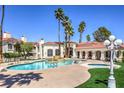 Resort-style pool and spa area with palm trees and lounge seating, perfect for relaxation and community gatherings at 698 S Racetrack Rd # 1014, Henderson, NV 89015