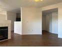 Open concept living area featuring tile flooring, modern fireplace and neutral paint palette at 698 S Racetrack Rd # 1411, Henderson, NV 89015