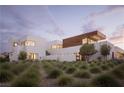 Modern home with a sleek design and natural landscaping at 7030 Schirlls St, Las Vegas, NV 89118