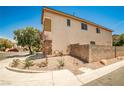 The side of a home featuring a neutral color palette, and rock landscaping at 7083 Somera Way, Las Vegas, NV 89113