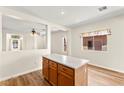 Kitchen island with white countertop and warm wood cabinetry at 8113 Danaides Ct, Las Vegas, NV 89131