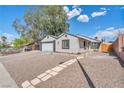 Lovely home with a well-manicured yard and driveway at 823 Spikenard Dr, Henderson, NV 89002