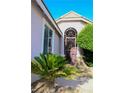 Inviting front entrance with stone accents and decorative security door at 8616 Willow Cabin St, Las Vegas, NV 89131