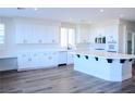 Bright, spacious kitchen featuring white cabinets, modern appliances, and a large island at 8616 Willow Cabin St, Las Vegas, NV 89131