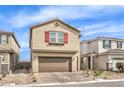 Charming two-story home featuring a brick driveway, two-car garage, red shutters, and low-maintenance landscaping at 9114 Riverlands Ranch St, Las Vegas, NV 89139
