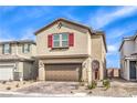 Charming two-story home featuring a brick driveway, two-car garage, red shutters, and low-maintenance landscaping at 9114 Riverlands Ranch St, Las Vegas, NV 89139