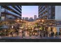 Outdoor courtyard with a vibrant social scene and dining areas at 924 S First St # 306C, Las Vegas, NV 89101