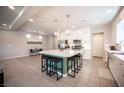 Open kitchen features a large island with seating and stainless steel appliances at 9807 Panther Hollow St, Las Vegas, NV 89141