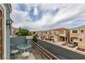 Balcony view overlooking a quiet street with similar homes, showcasing neighborhood charm at 10373 Perfect Parsley St, Las Vegas, NV 89183