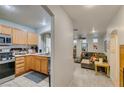 Open-concept view of the kitchen and living room, creating an inviting and connected living space at 10373 Perfect Parsley St, Las Vegas, NV 89183