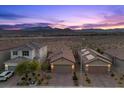 Scenic aerial view of homes with beautiful desert mountain views and colorful sky at 10431 Seelos St, Las Vegas, NV 89178