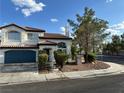 Beautiful two-story home featuring a tile roof, manicured landscaping, and a spacious two-car garage, offering great curb appeal at 1511 Balsam Mist Ave, Las Vegas, NV 89183